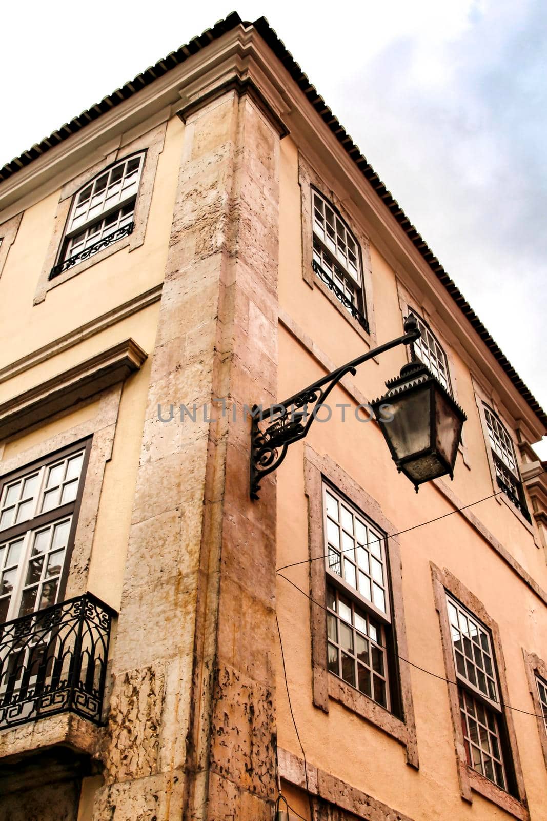 Narrow and colorful streets, majestic facades, windows and balconies of Lisbon, Portugal