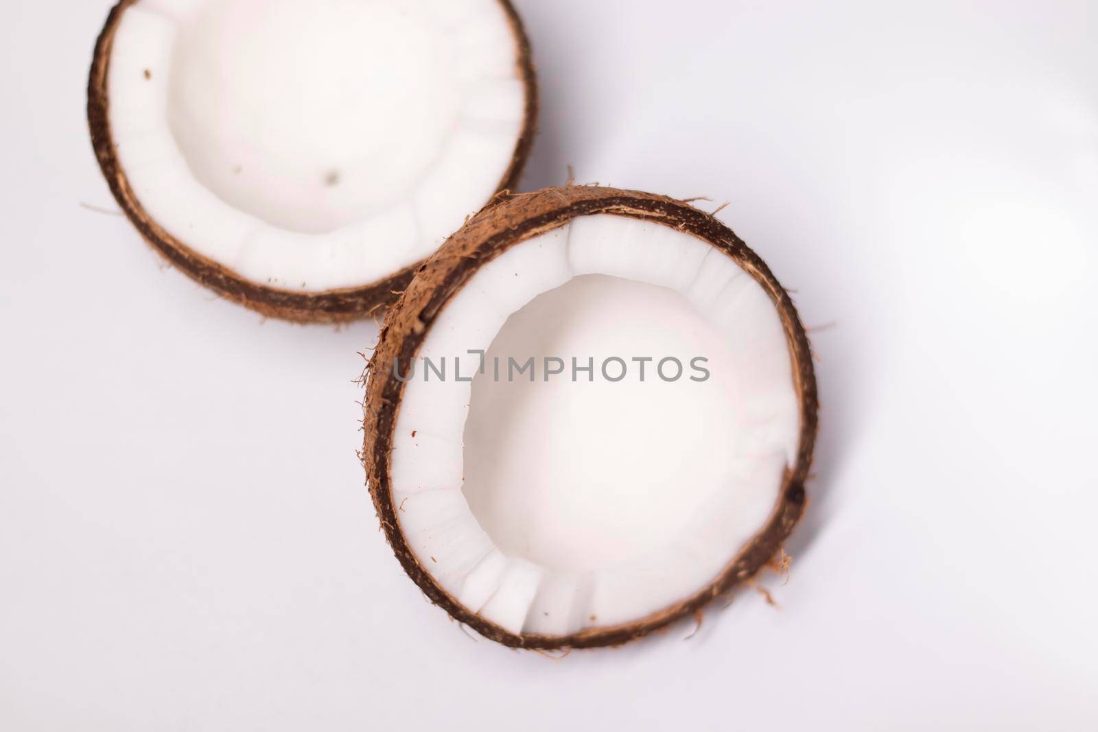 opened coconut isolated on white background. tropical fruit, nut.