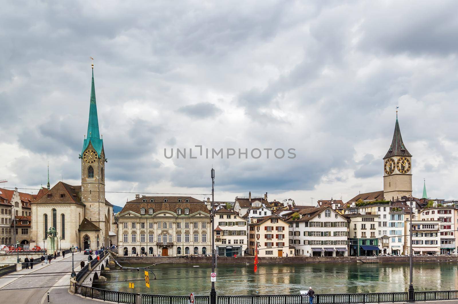 View of Limmat river with  Fraumunster and st. Peter church in Zurich, Switzerland