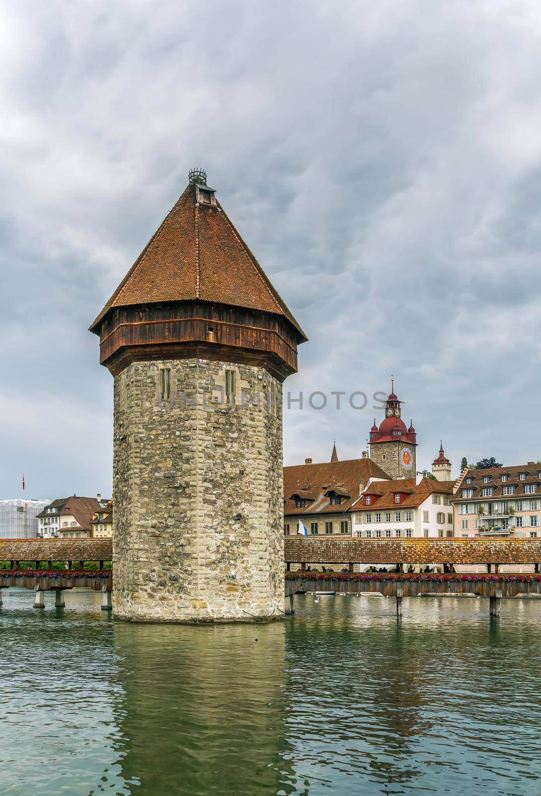 As part of the bridge complex, the Kapellbrucke includes the octagonal tall Wasserturm (water tower), Lucerne,Switzerland