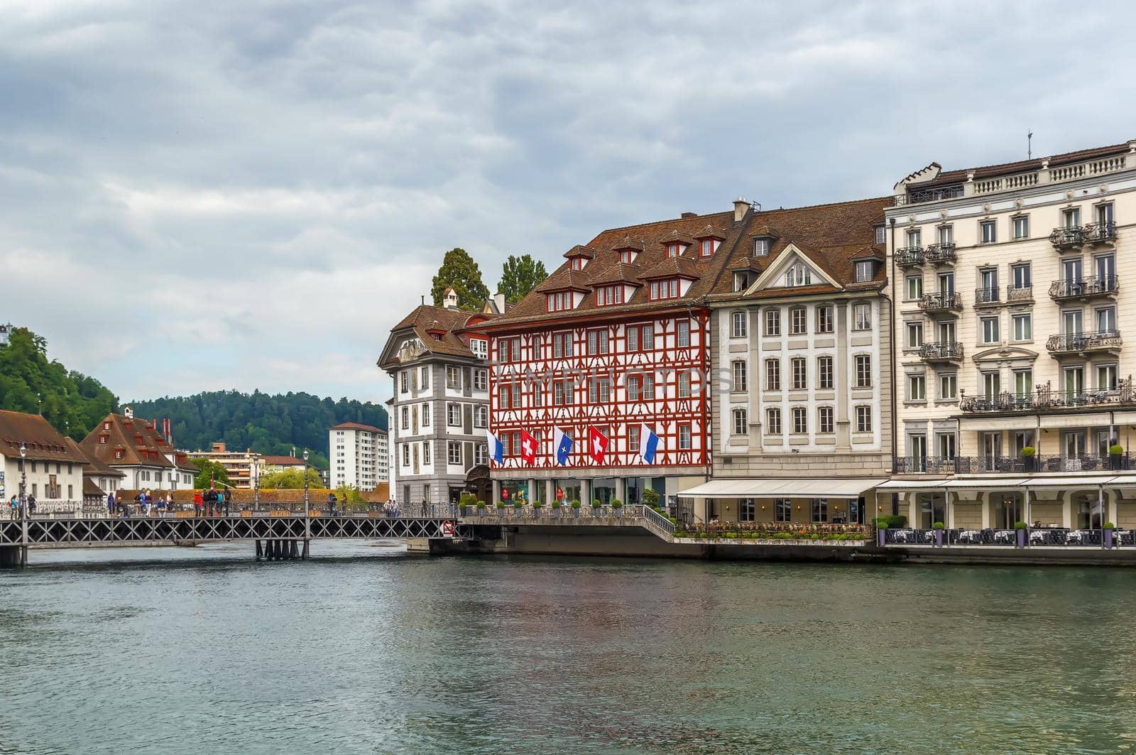 Picturesque historical buildings on the embankment of Reuss river in Lucerne, Switzerland