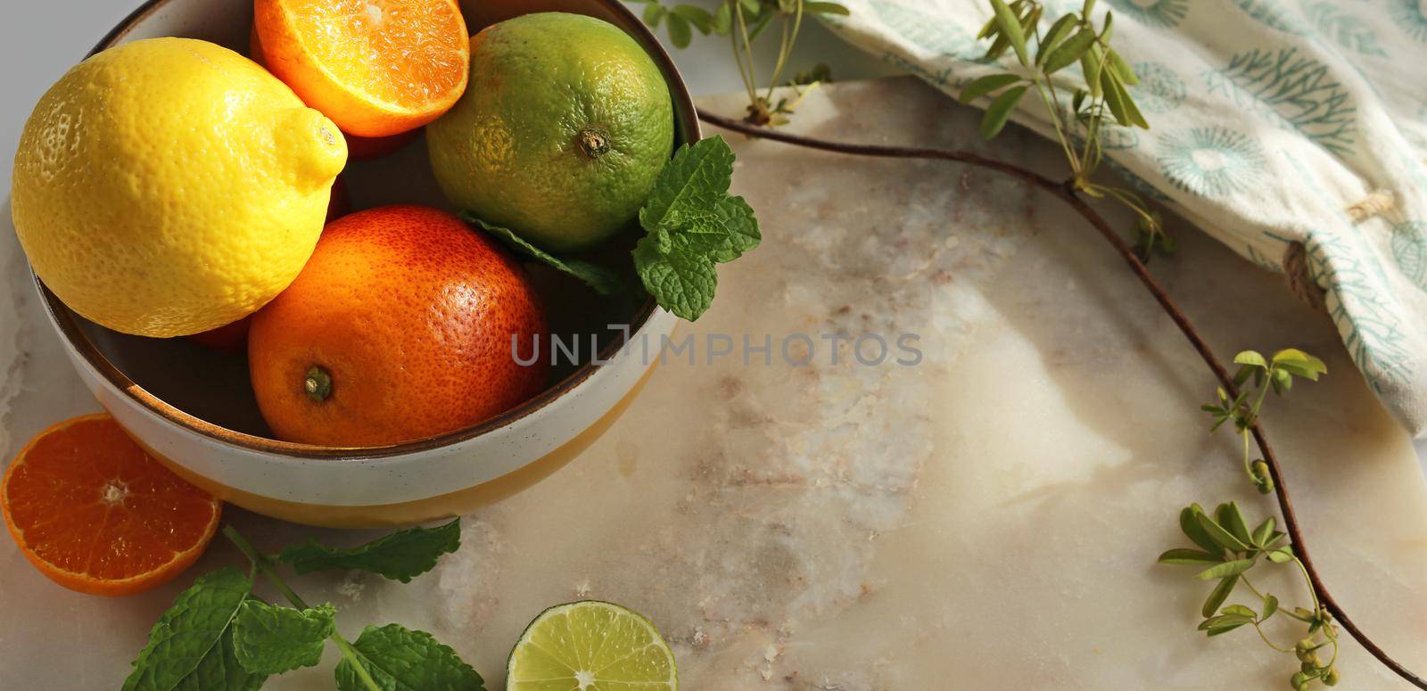 Citrus on marble kitchen table by NelliPolk