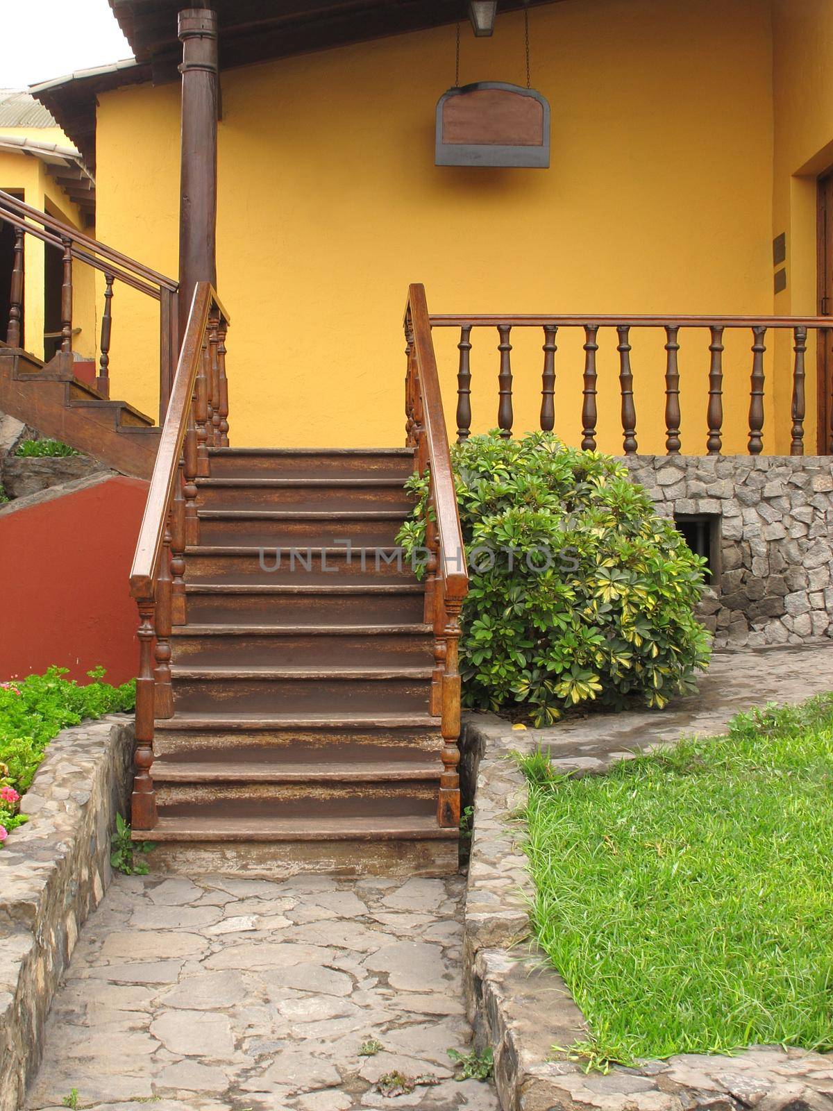 An old town house with front staircase by aroas