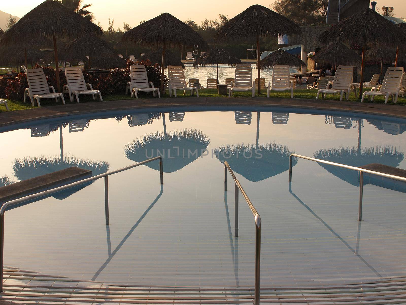 Swimming pool area of hotel with umbrella and beach chair Lima-Peru