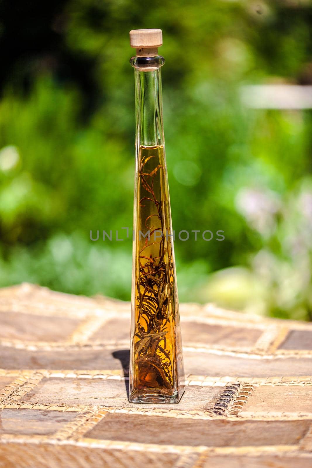 Oil and Herbs in a bottle  by Weltblick