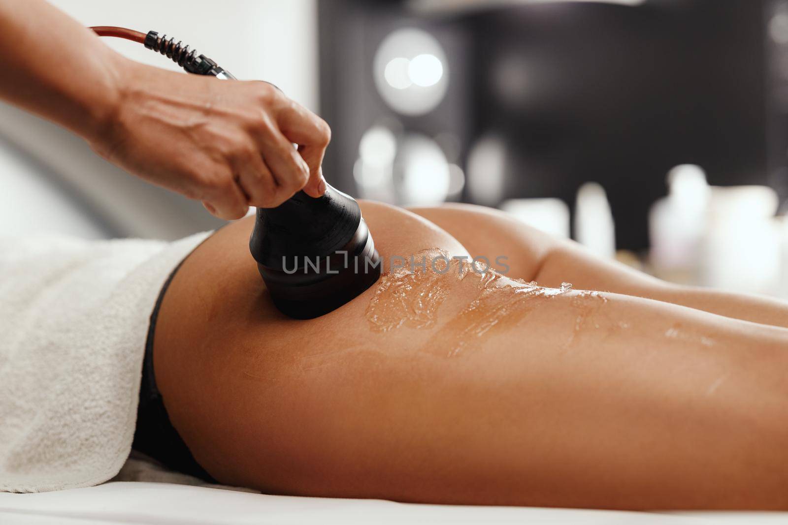 Shot of an unrecognizable woman getting an anti cellulite massage at the beauty salon. She have a vacuum treatment to fat reduction.