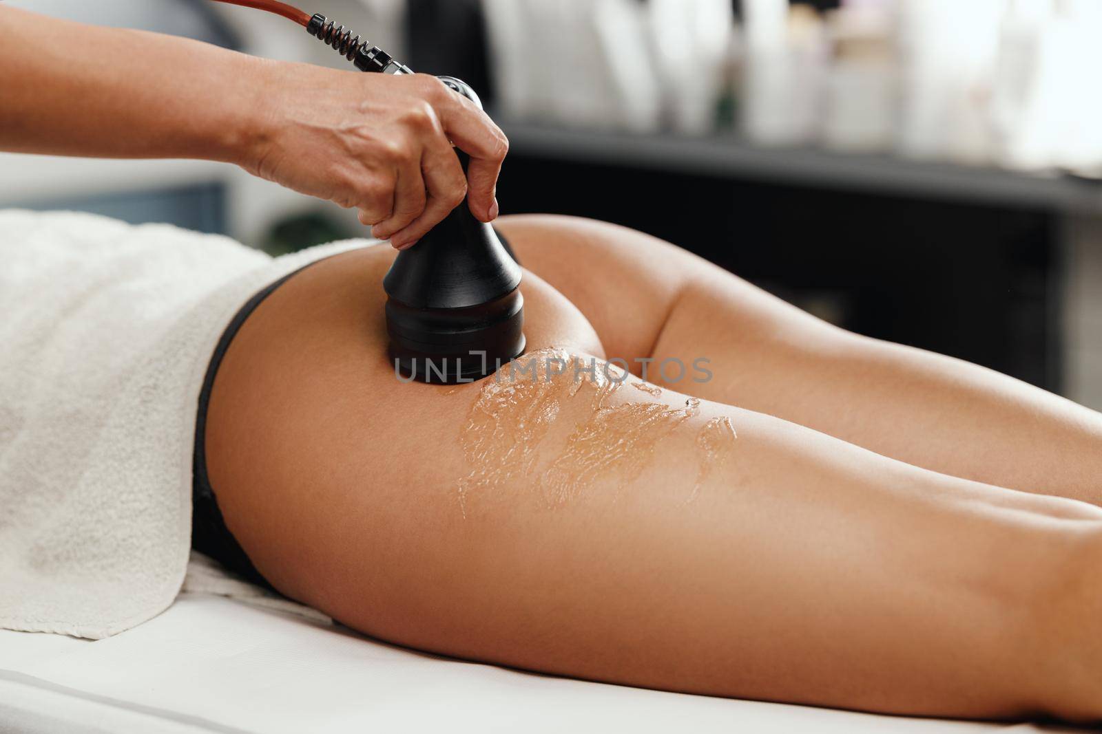 Shot of an unrecognizable woman getting an anti cellulite massage at the beauty salon. She have a vacuum treatment to fat reduction.