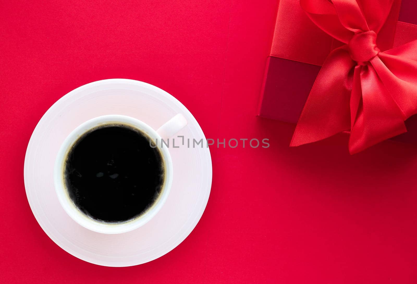 Romantic celebration, lifestyle and birthday present concept - Luxury beauty gift box and coffee on red, flatlay