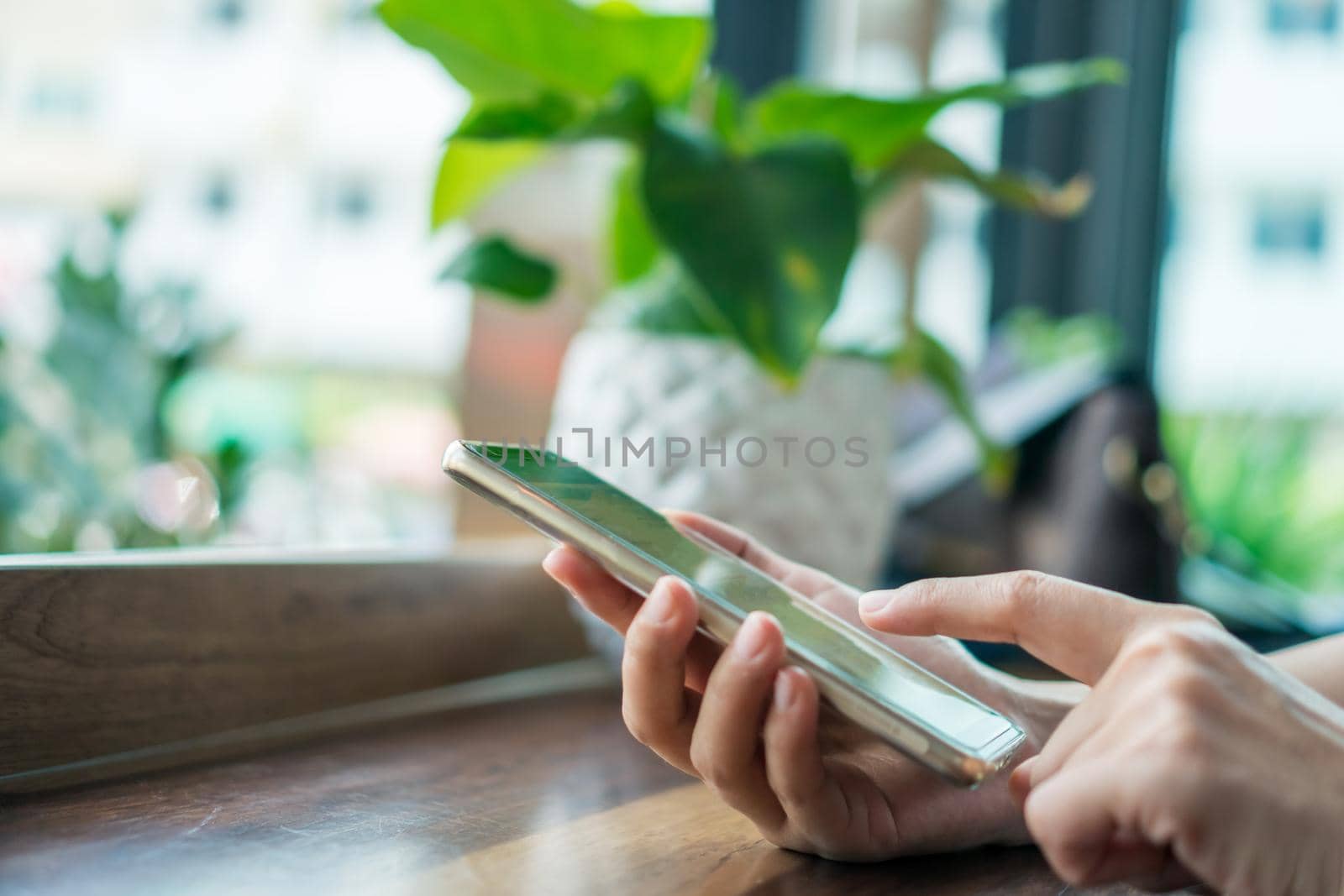 Woman hand using smartphone to do work business, social network, communication concept.