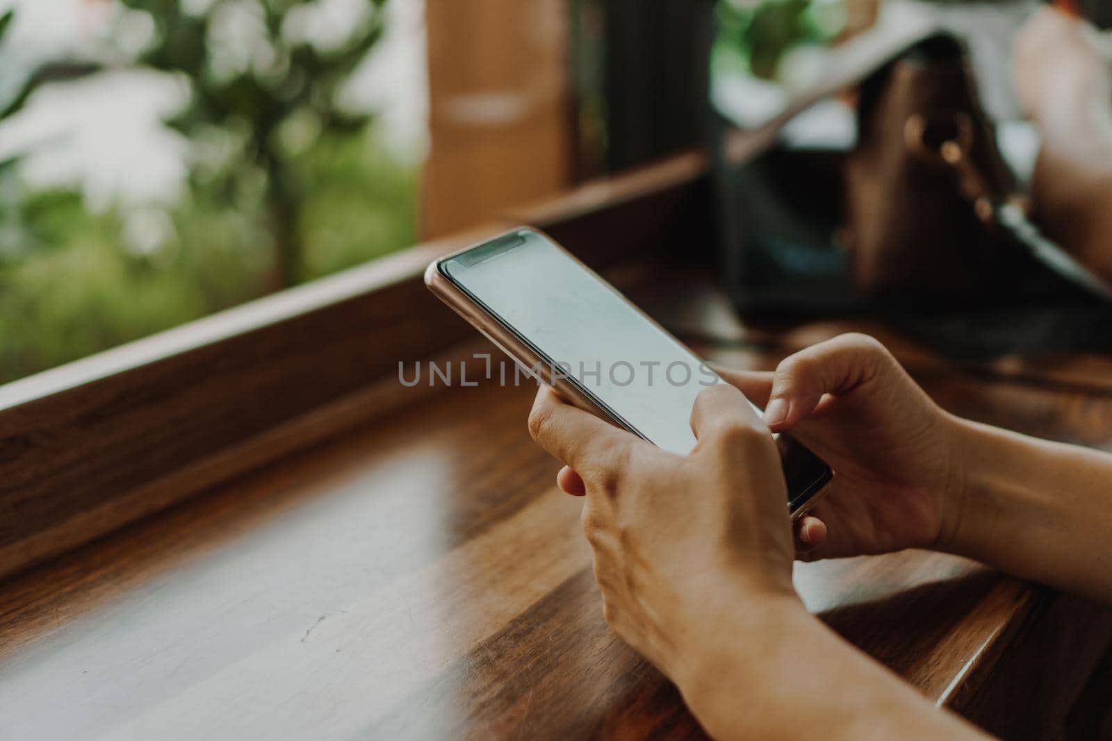 Woman hand using smartphone to do work business, social network, communication concept.