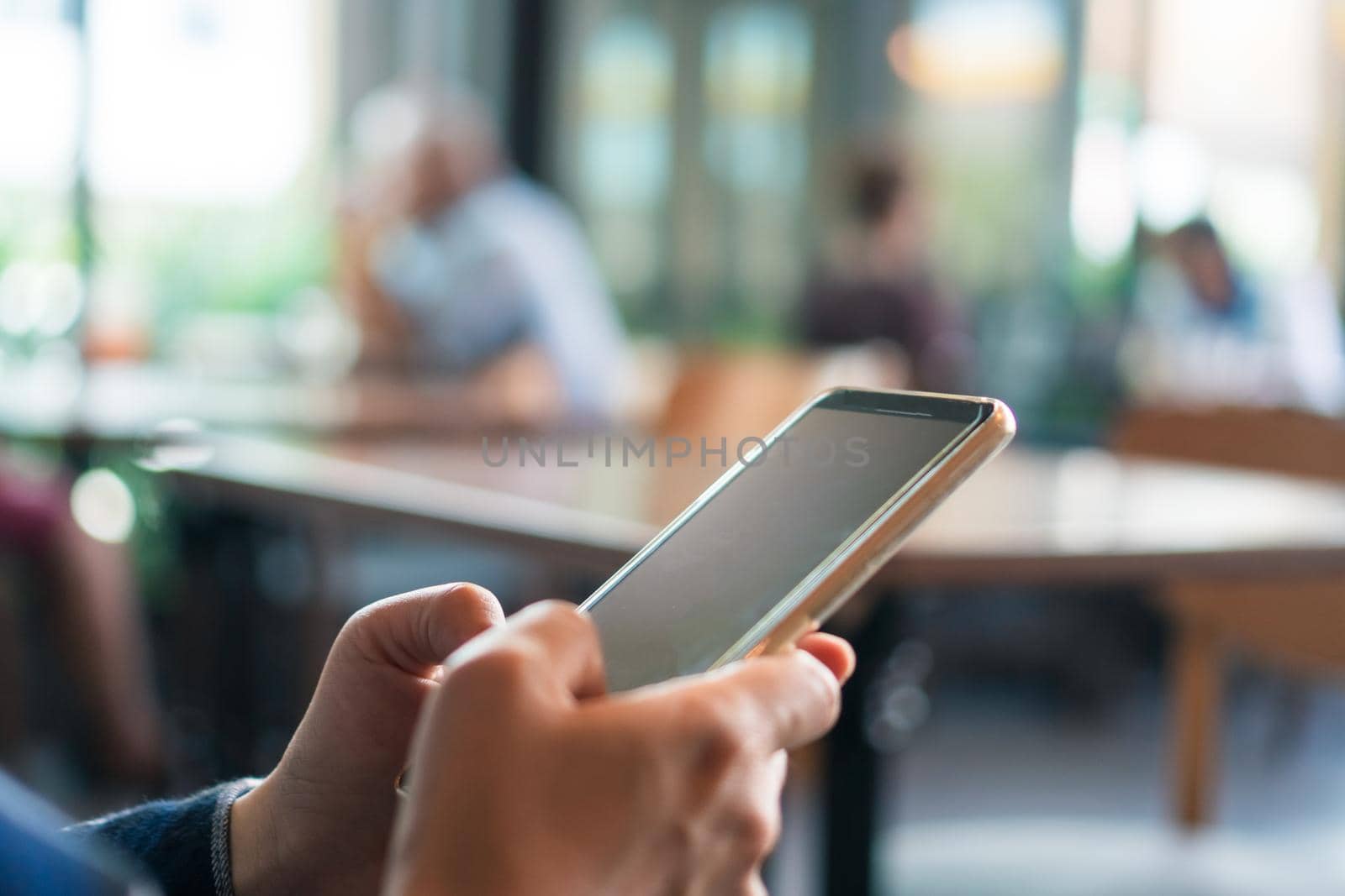 Woman hand using smartphone to do work business, social network, communication. by Suwant