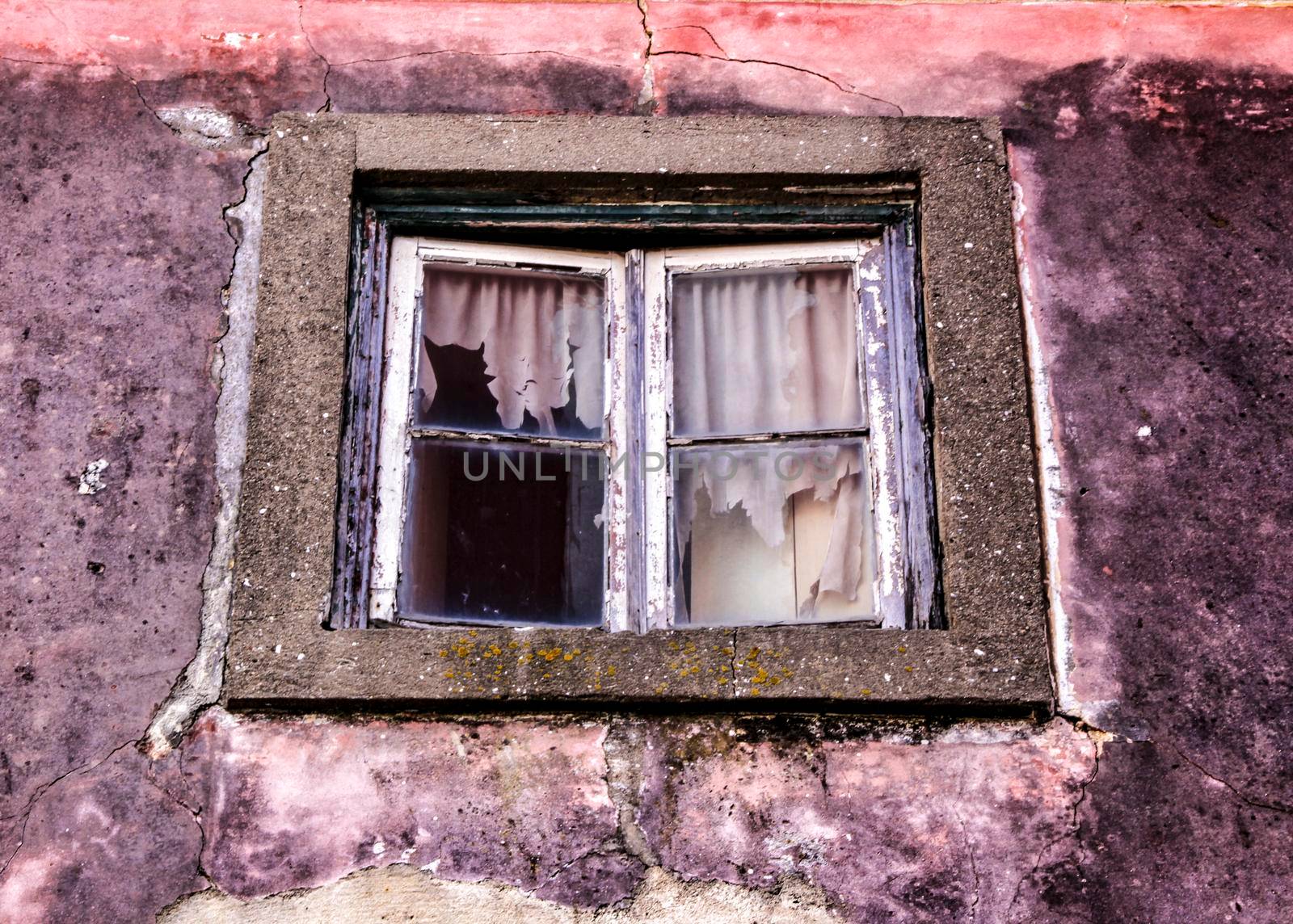 Old and colorful damaged facade in Lisbon