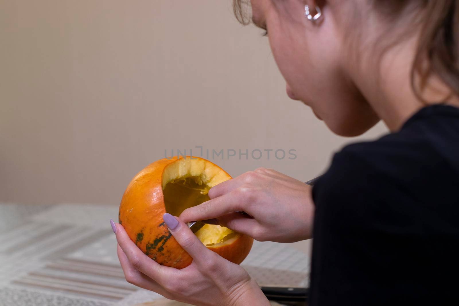 the process of making a Halloween pumpkin. cleansing of seeds. horror theme and Hallowe'en by oliavesna