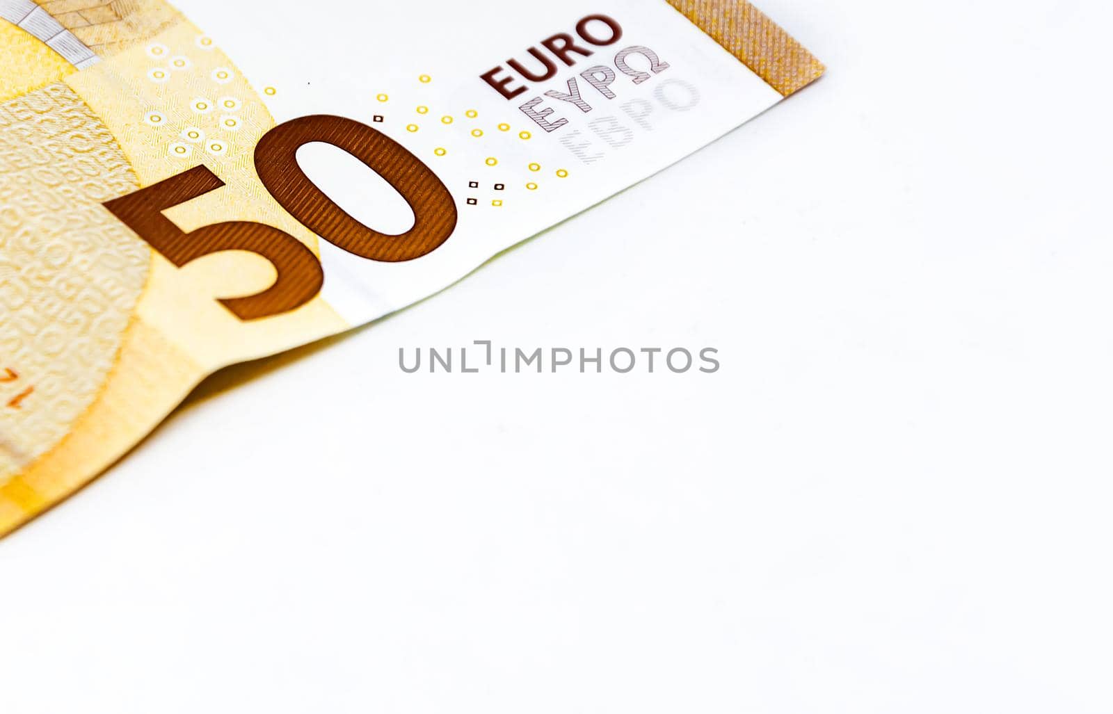 Detail of a 50 euro banknote isolated on a white background. by rarrarorro