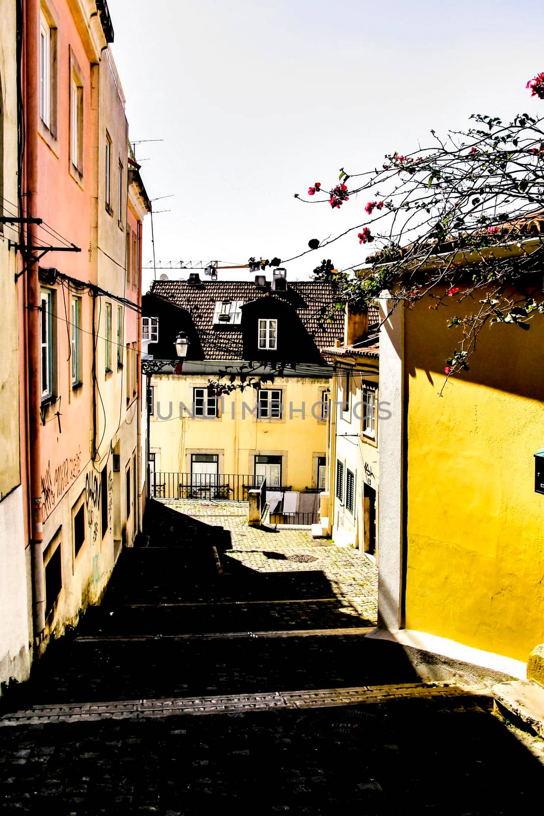 Narrow and colorful streets, majestic facades, windows and balconies of Lisbon, Portugal