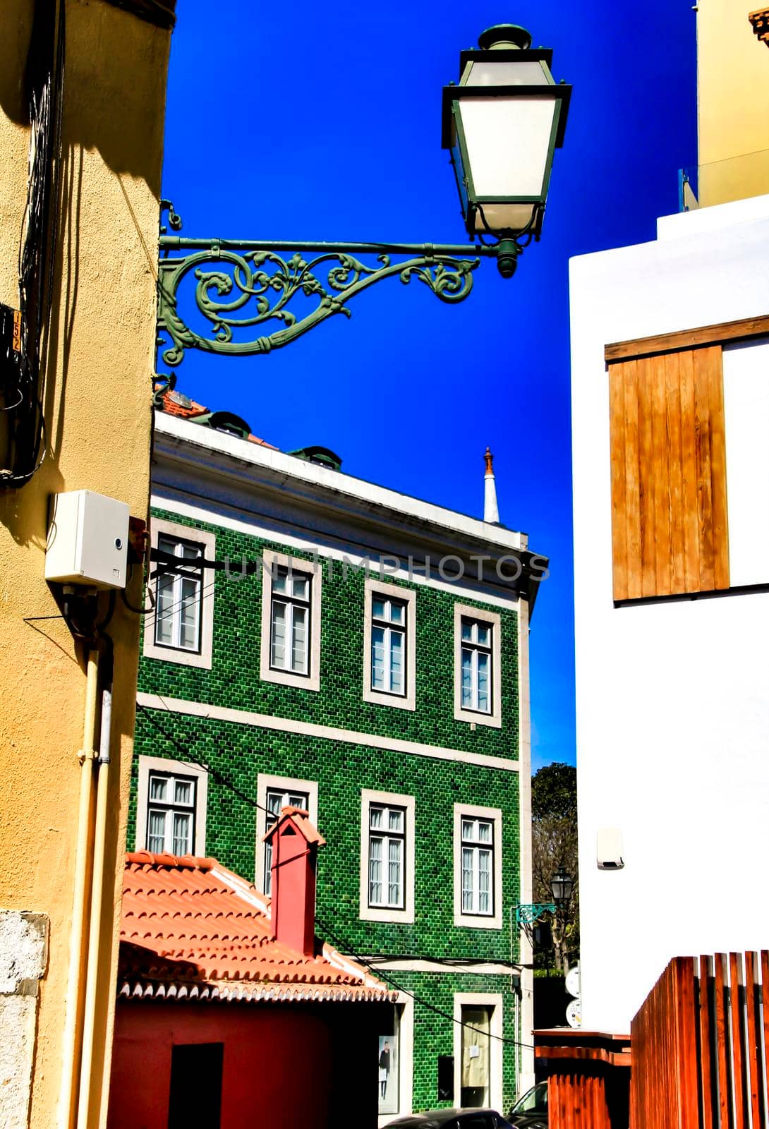 Narrow and colorful streets, majestic facades, windows and balconies of Lisbon, Portugal