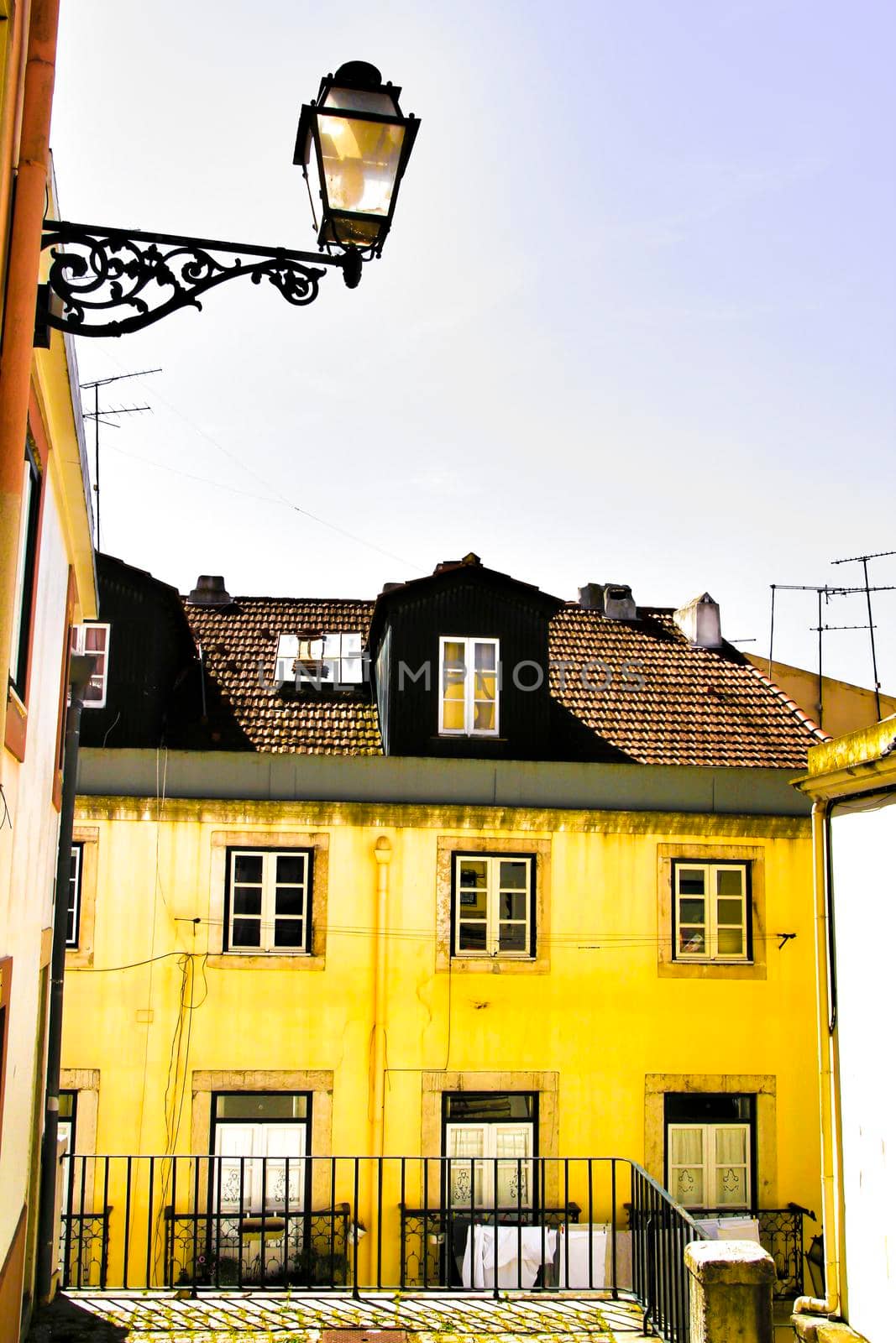 Narrow and colorful streets, majestic facades, windows and balconies of Lisbon, Portugal