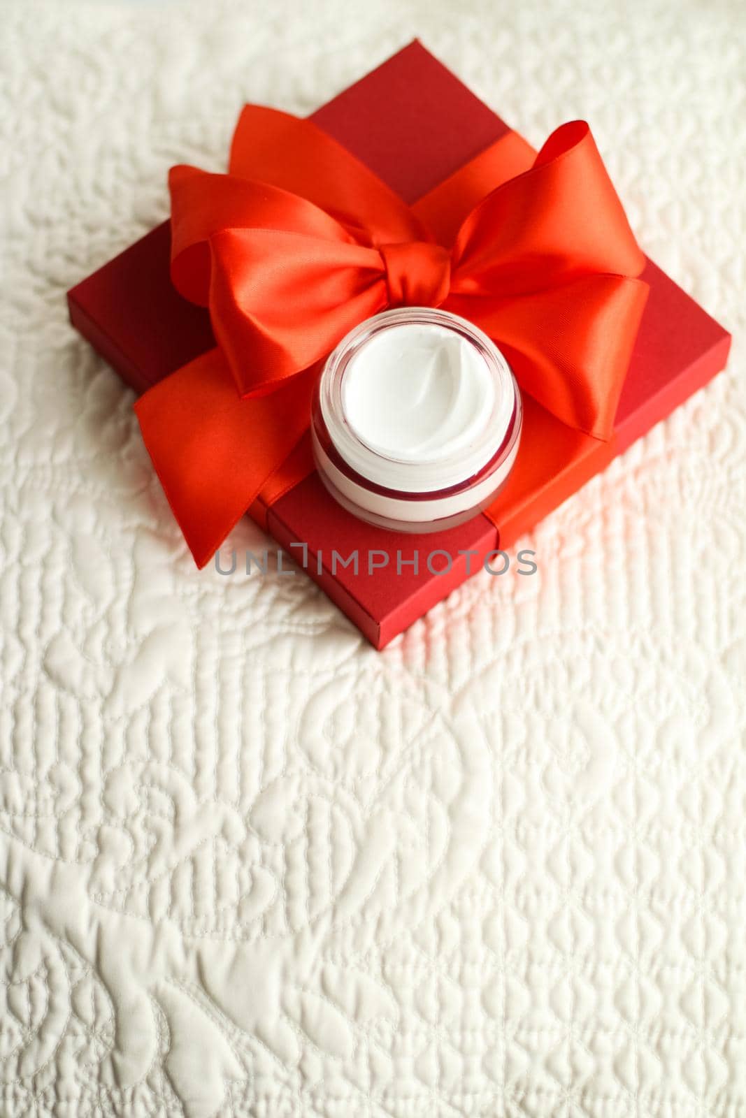 Beauty, cosmetics and skincare styled concept - Luxury face cream jar and red gift box