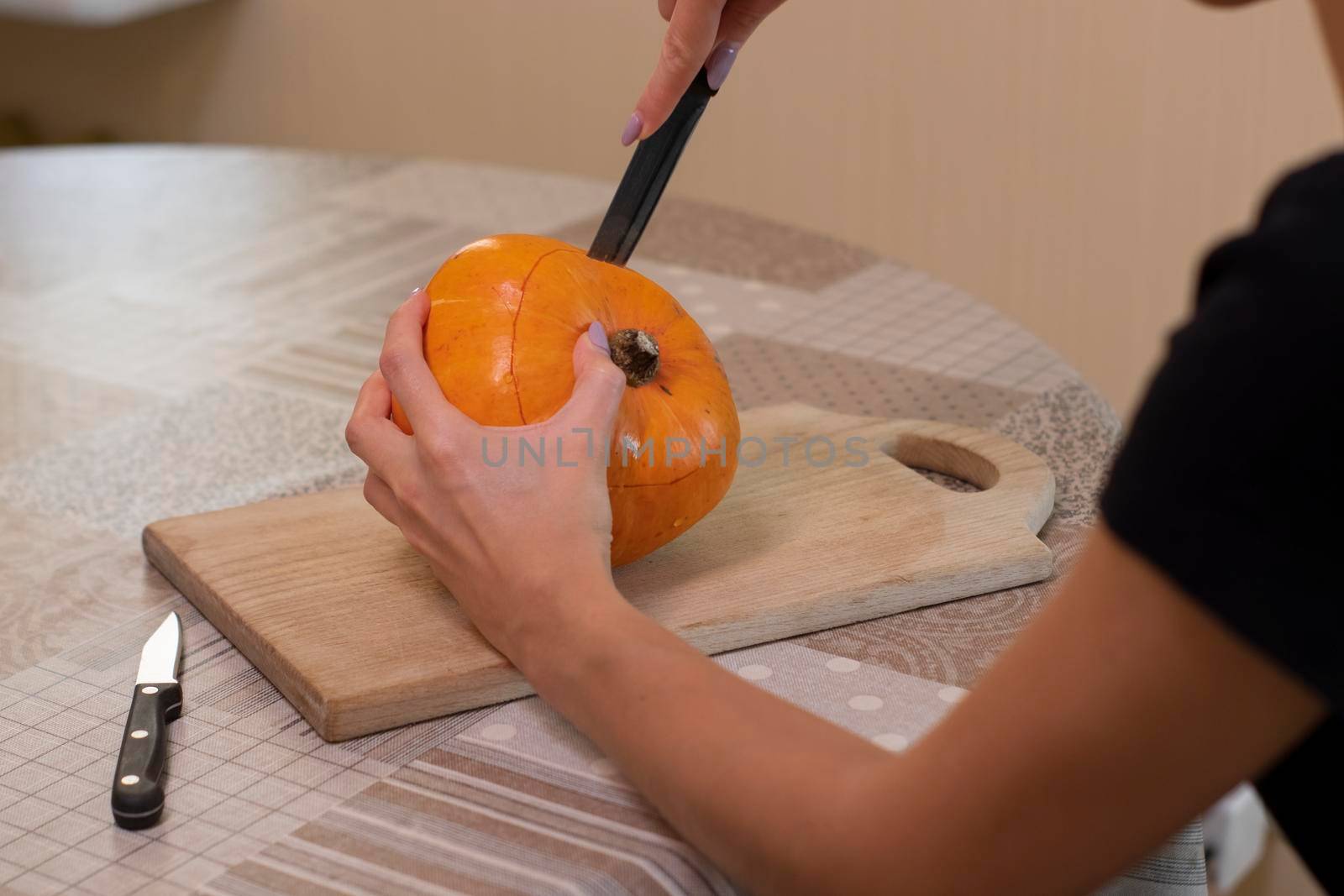 the process of making a Halloween pumpkin. horror theme and Hallowe'en.