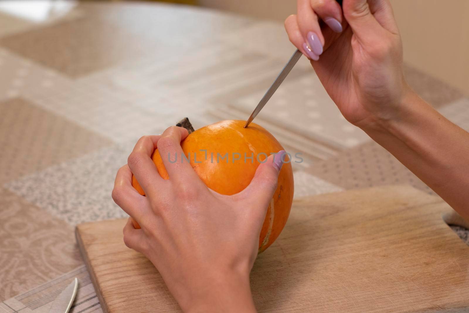 the process of making a Halloween pumpkin. horror theme and Hallowe'en.