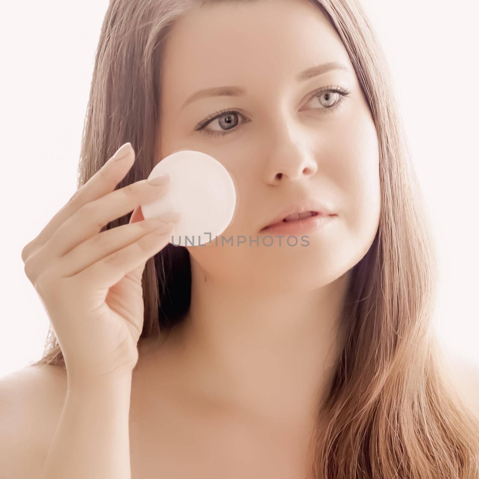 Beautiful woman with cotton pad, perfect skin and shiny hair as make-up, health and wellness concept. Face portrait of young female model for skincare cosmetics and luxury beauty ad design by Anneleven