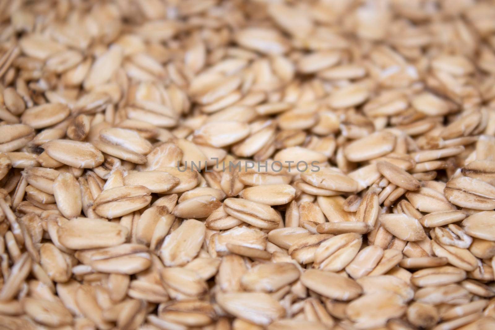 Macro Oatmeal texture. oat flakes food background. Healthy breakfast concept. Muesli cereals