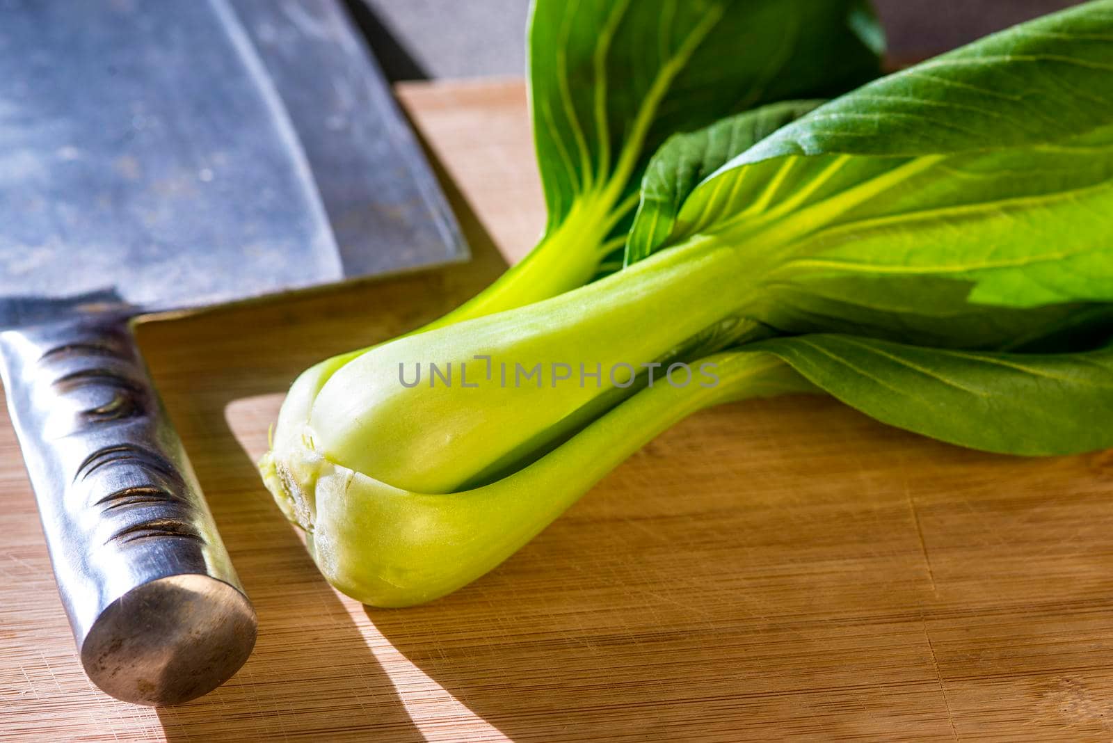 Pak choi with a Chinese kitchen axe