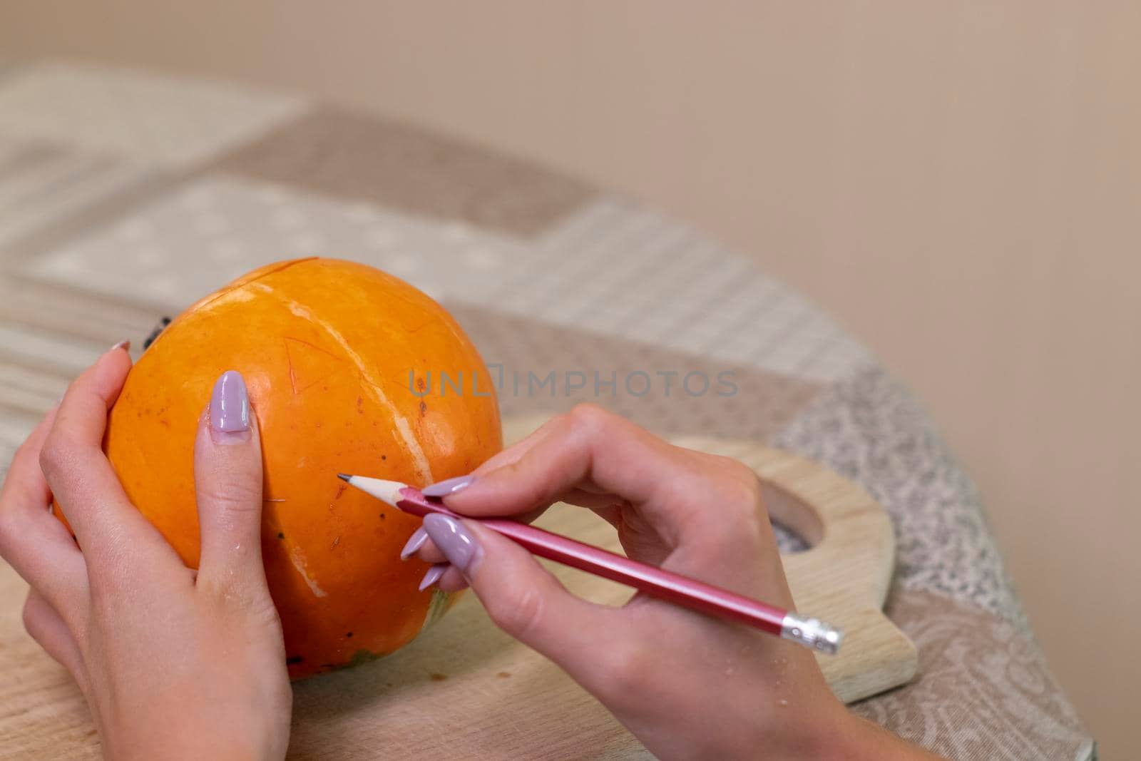 the process of making a Halloween pumpkin. drawing a layout. horror theme and Hallowe'en.