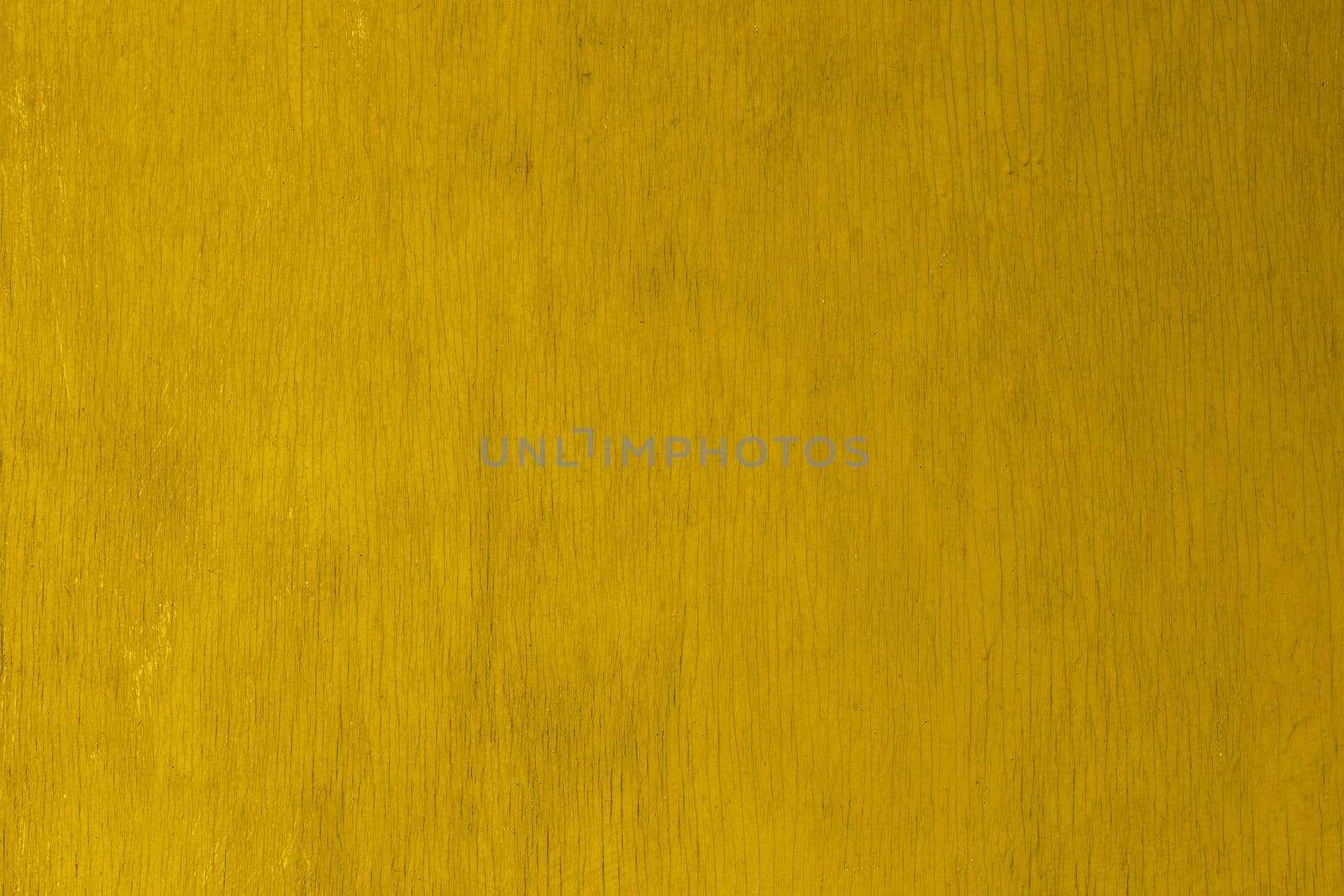 old yellow painted plywood flat surface texture and background with even vertical cracks
