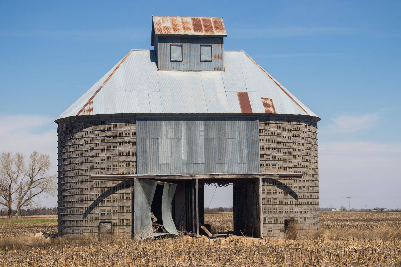 old corn silo or corn crib by clarks Nebraska in a corn field. High quality photo