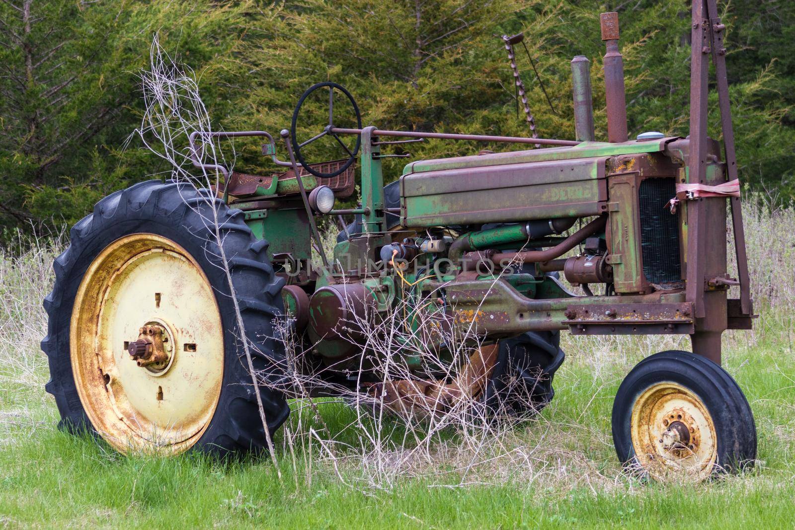 Old Rustic tractor on Nebraska land scape by gena_wells