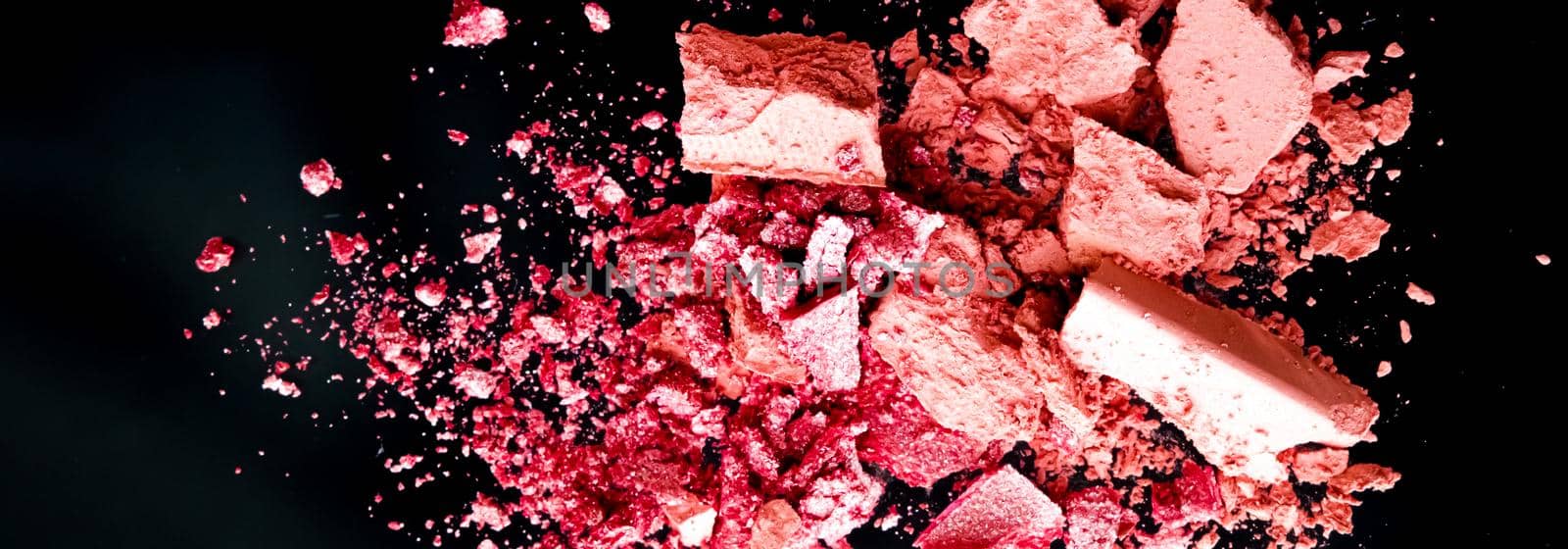 Crushed cosmetics, mineral organic eyeshadow, blush and cosmetic powder isolated on black background, makeup and beauty banner, flatlay design.