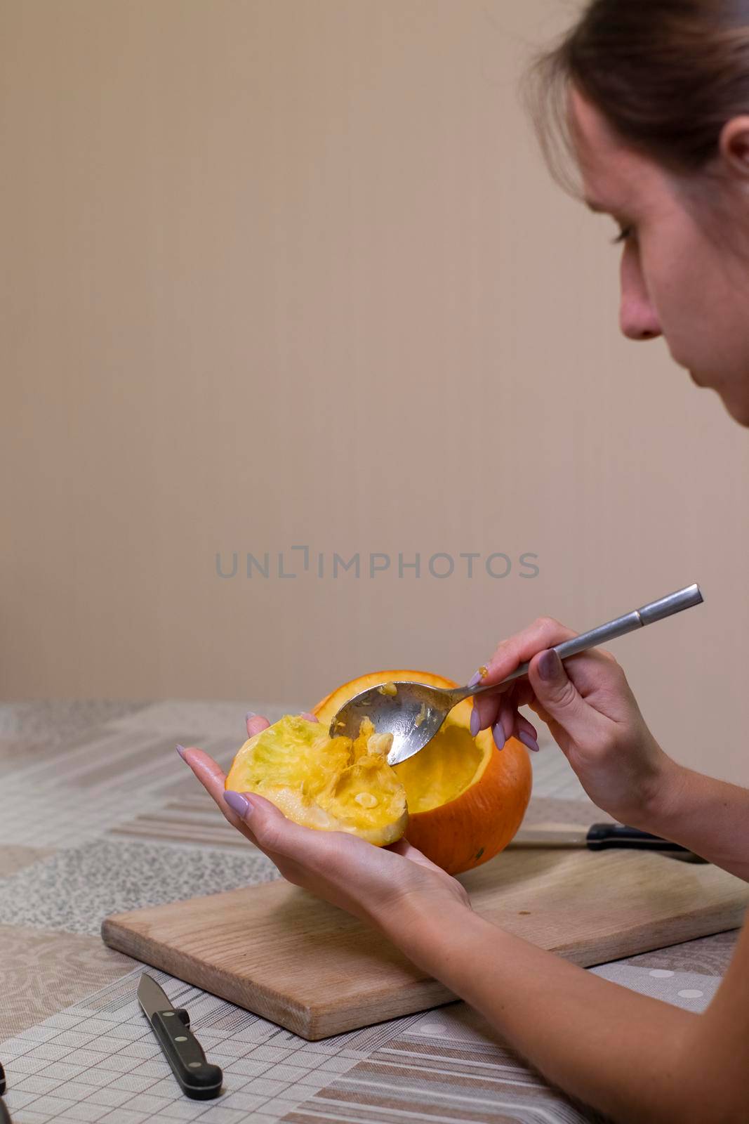 the process of making a Halloween pumpkin. cleansing of seeds. horror theme and Hallowe'en.