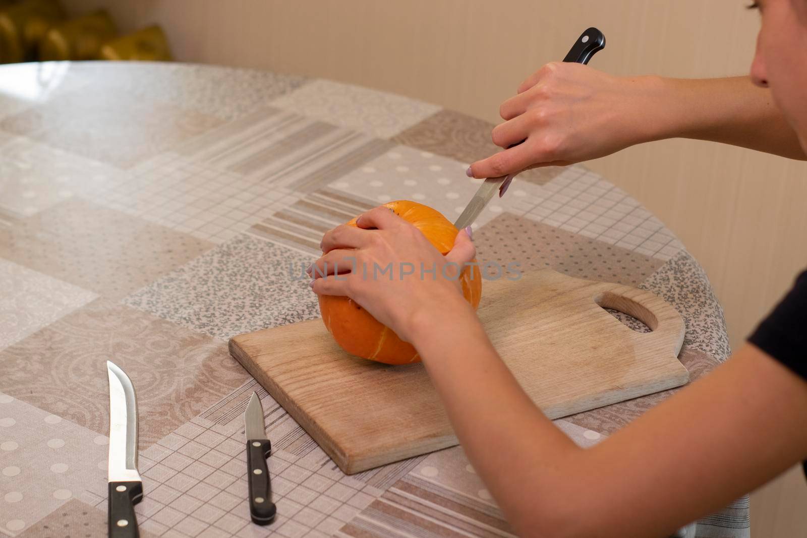 the process of making a Halloween pumpkin. horror theme and Hallowe'en.