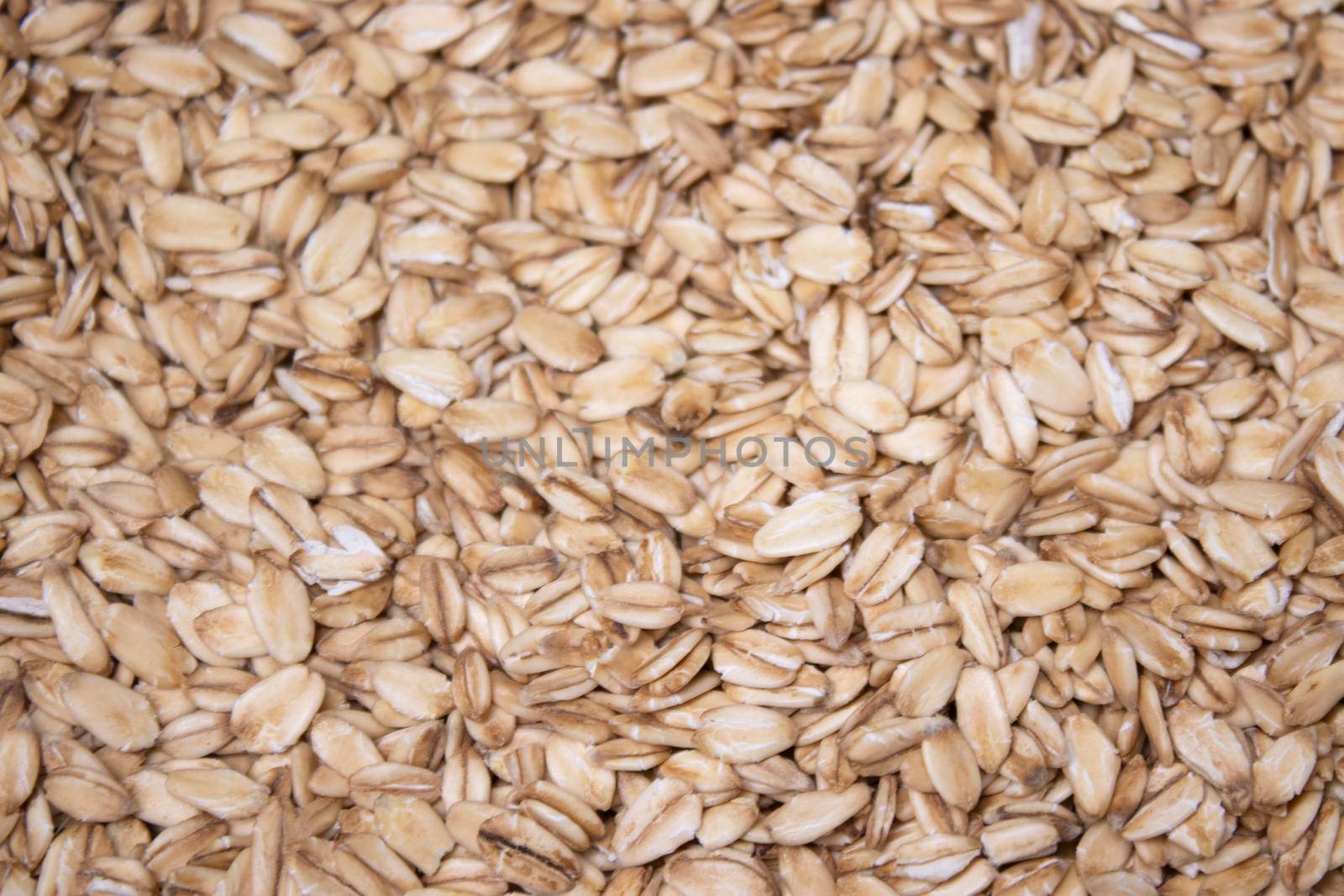 Macro Oatmeal texture. oat flakes food background. Healthy breakfast concept. Muesli cereals