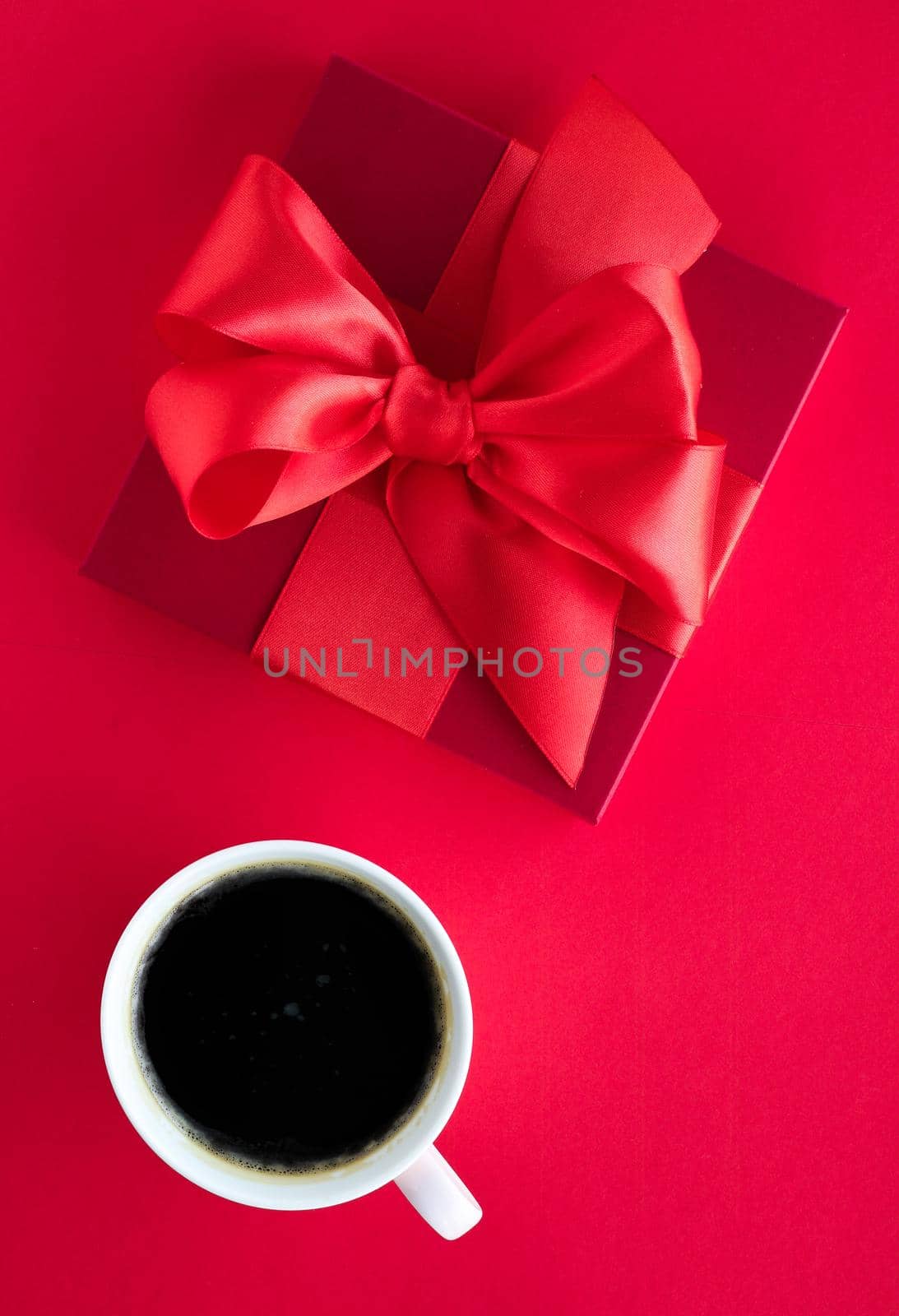 Romantic celebration, lifestyle and birthday present concept - Luxury beauty gift box and coffee on red, flatlay