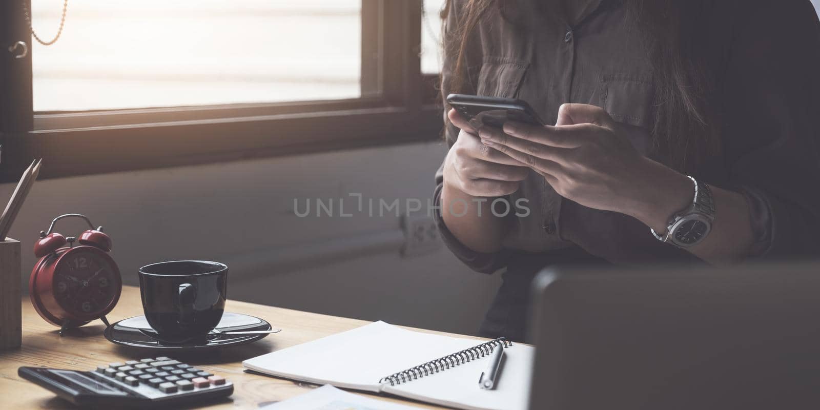 Female using smartphone in living room at home