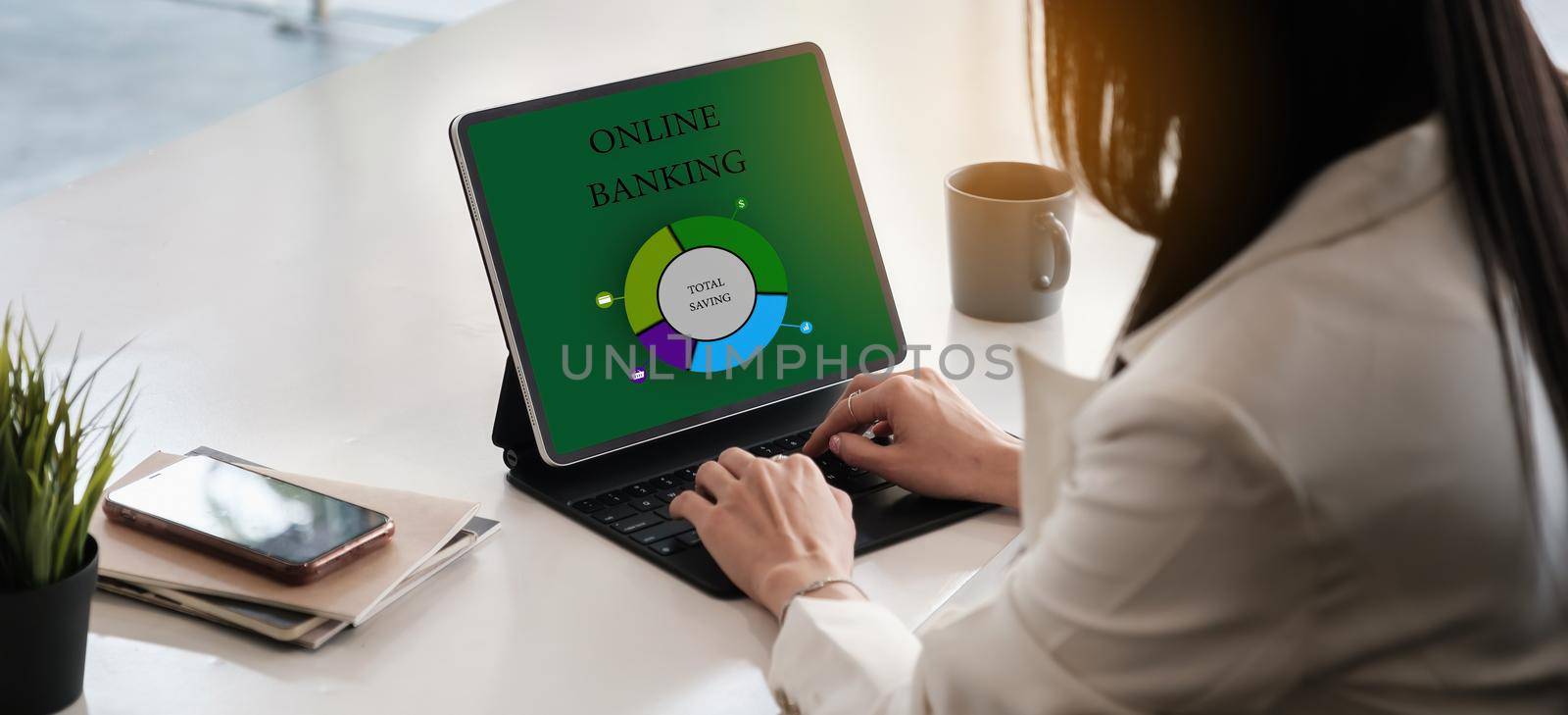 Business woman using digital tablet and using bank savings account application, account or saving money or insurance concept.