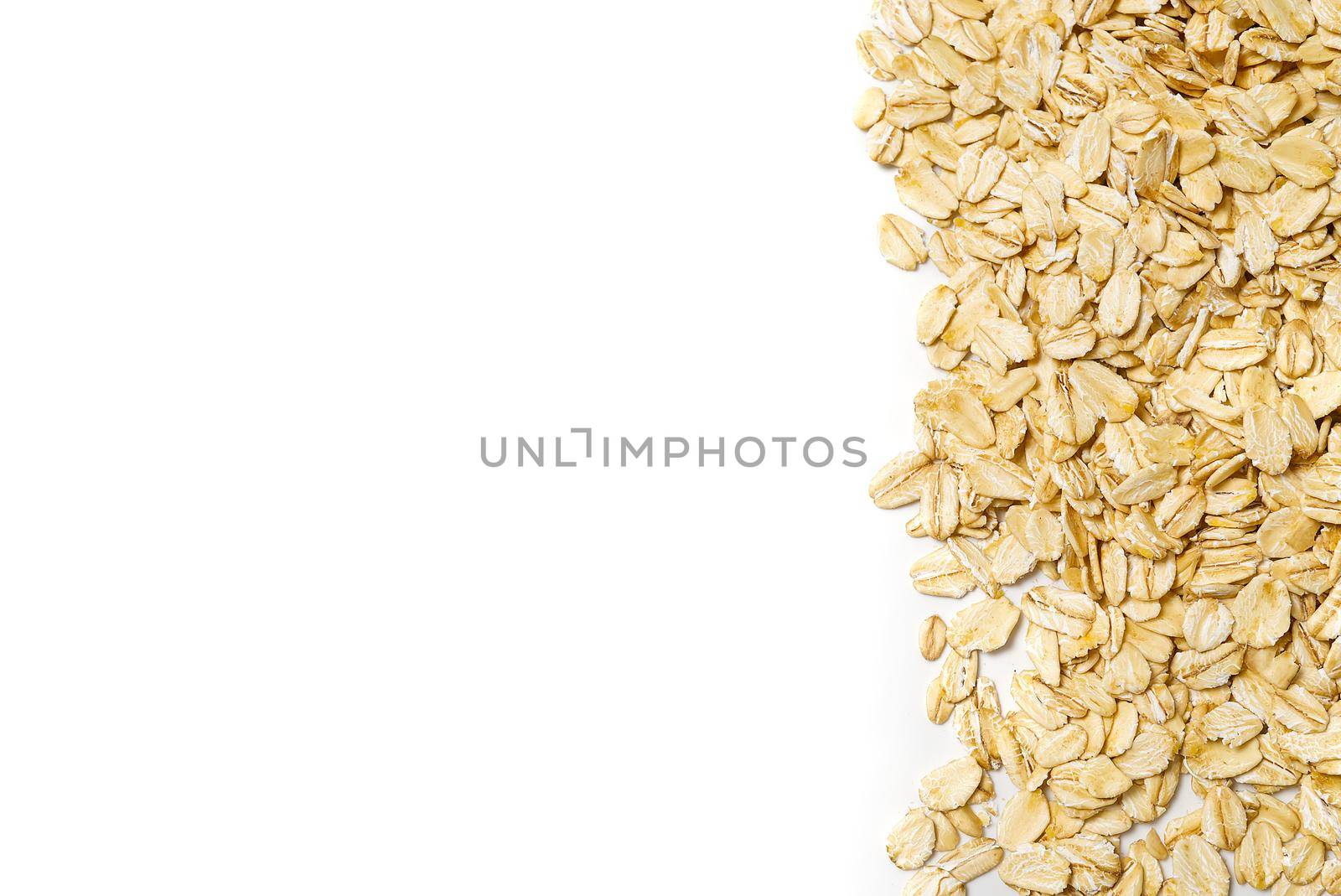 the oat flakes on a white isolated background copy space by PhotoTime