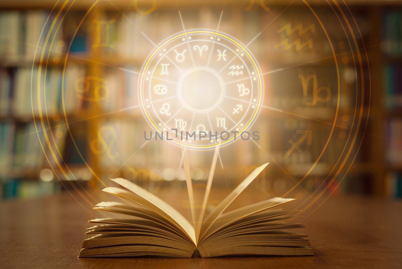 Horoscope astrology, Zodiac sign and constellation study for foretell and fortune telling education course concept with horoscopic wheel over old book in school library.