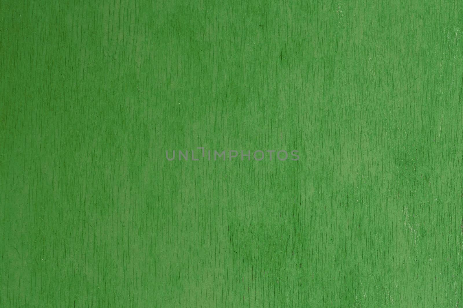 old green painted plywood flat surface texture and background with even vertical cracks