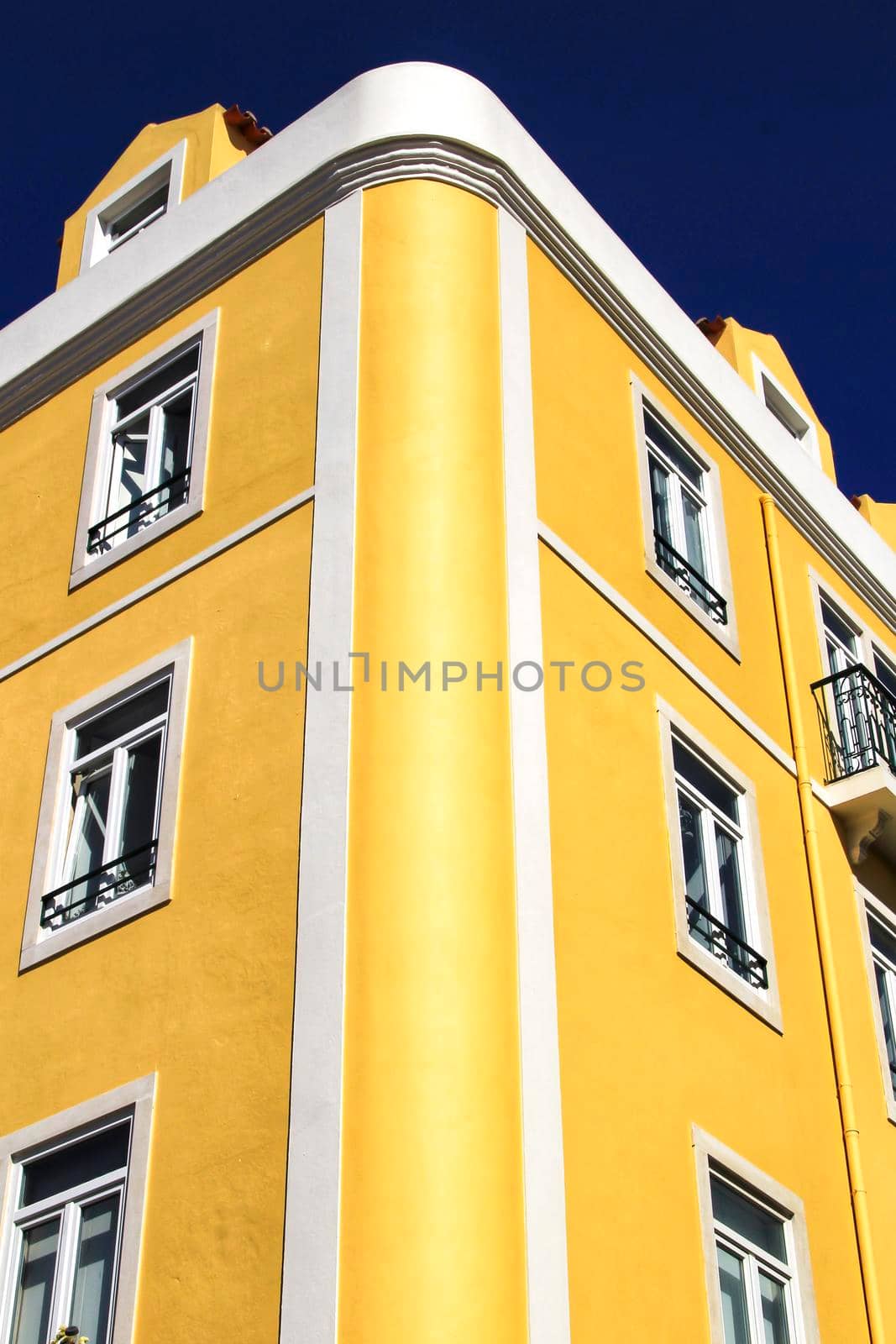 Old colorful houses and streets of Lisbon, Portugal in Spring. Majestic facades and old street lights.