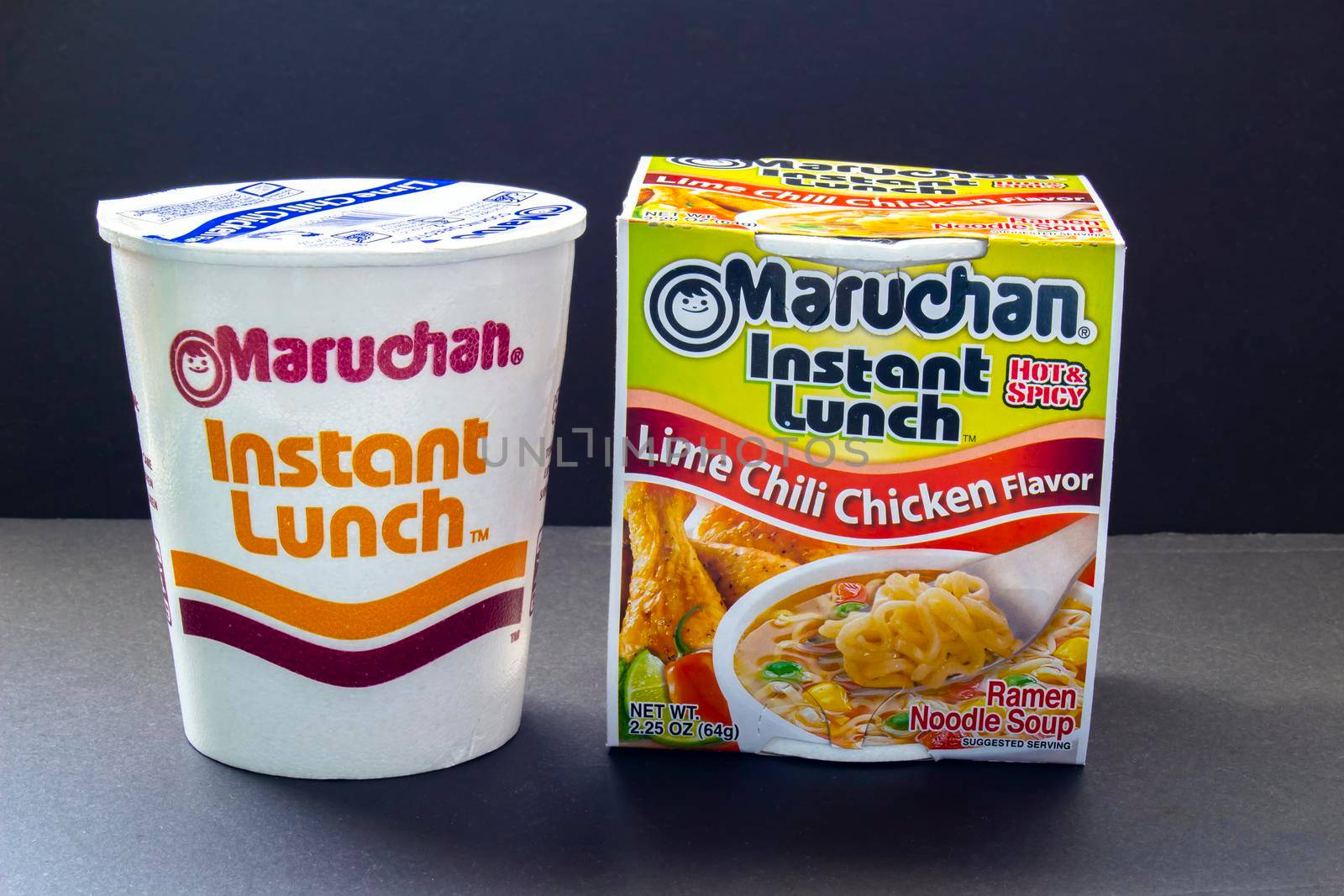 Calgary, Alberta, Canada. Oct 30, 2020. A couple of Instant Maruchan Lime Chili Chiken Flavor Noodle soup on a black background.