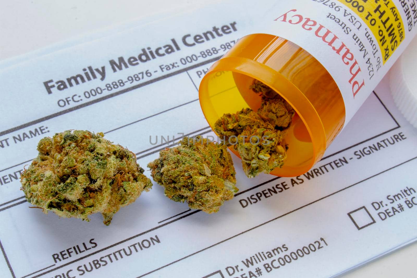 Close up of a medical cannabis bottle and on a generic prescription blank