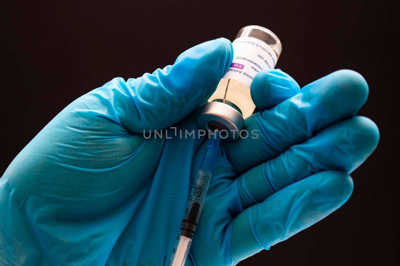 Calgary, Alberta. Canada. April 02, 2021. Health care worker with a AstraZeneca Vaccine and injection syringe.