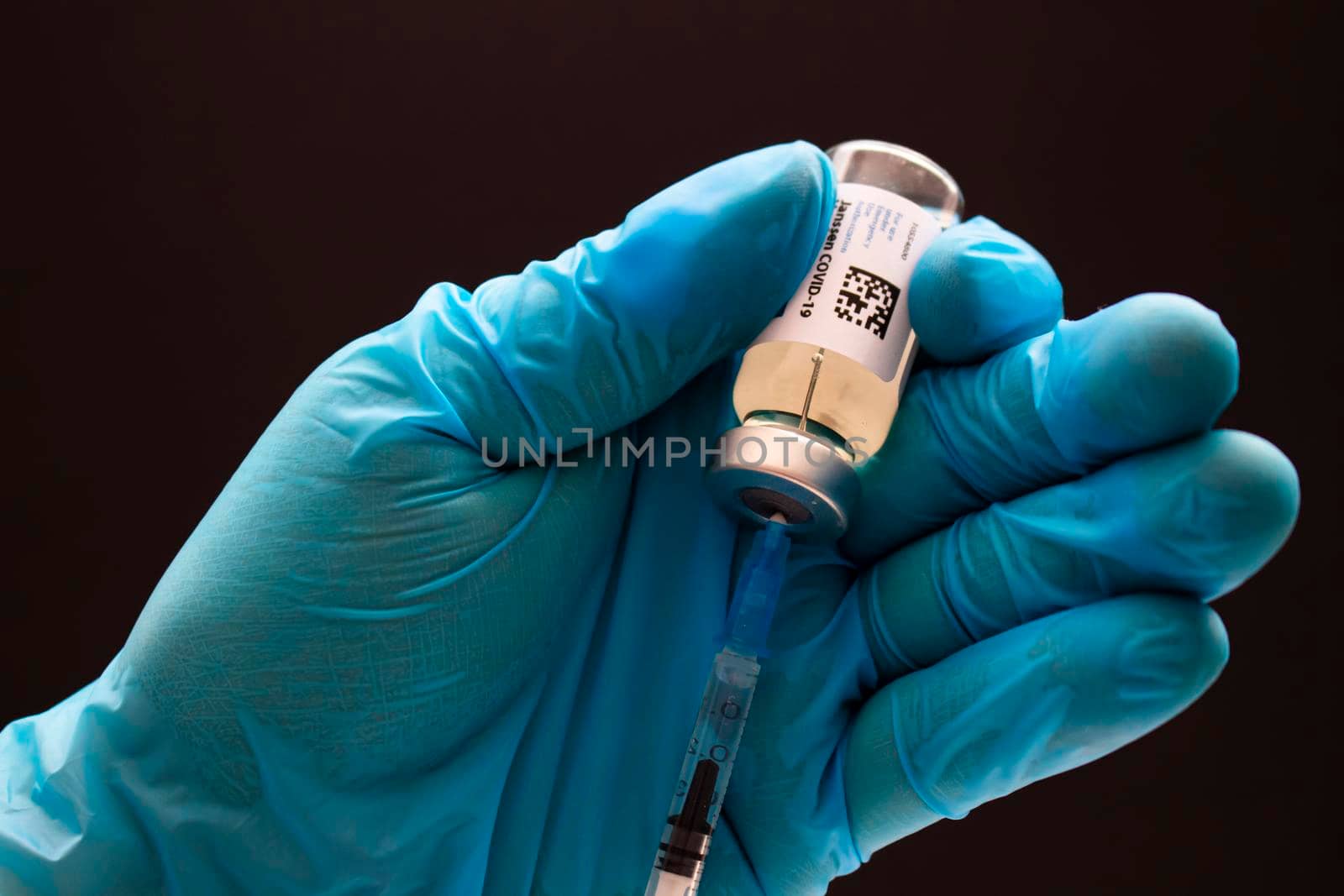 Calgary, Alberta. Canada. April 02, 2021. Health care worker with a Janssen or Johnson and johnson Vaccine and injection syringe. by oasisamuel