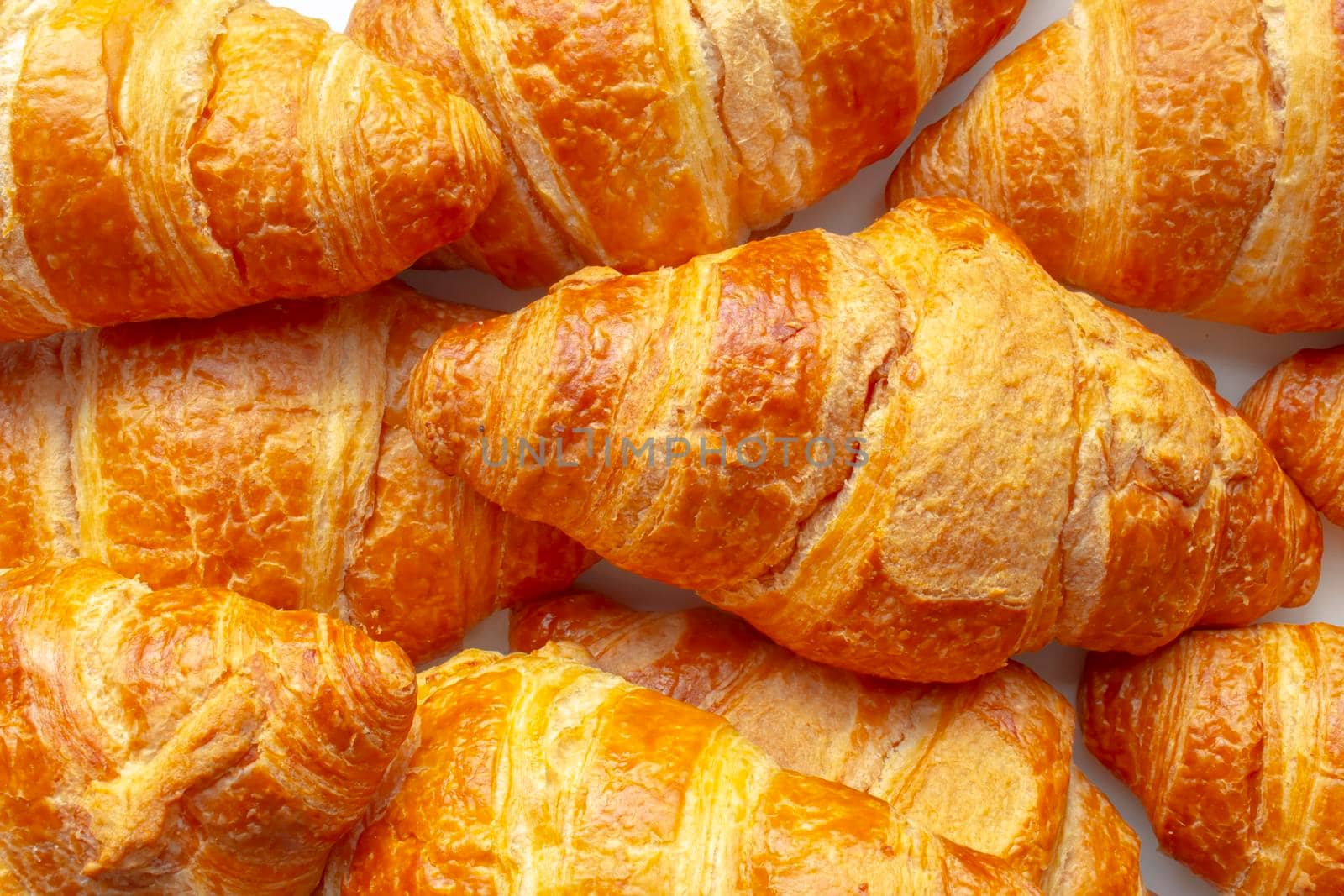 Several Croissants, crescent shape and, like other viennoiserie, are made of a layered yeast-leavened dough. by oasisamuel