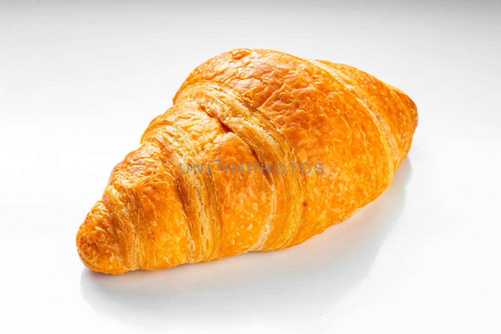 Front view of A Croissant on a white background.