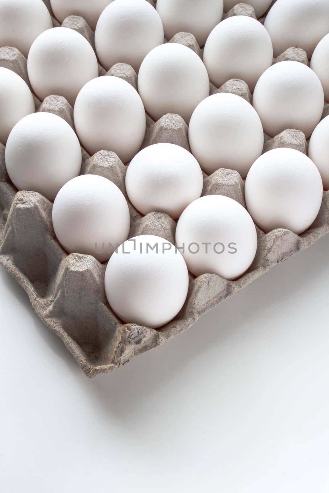 Vertical view of a Package Cardboard Egg Holder Egg Tray with eggs by oasisamuel