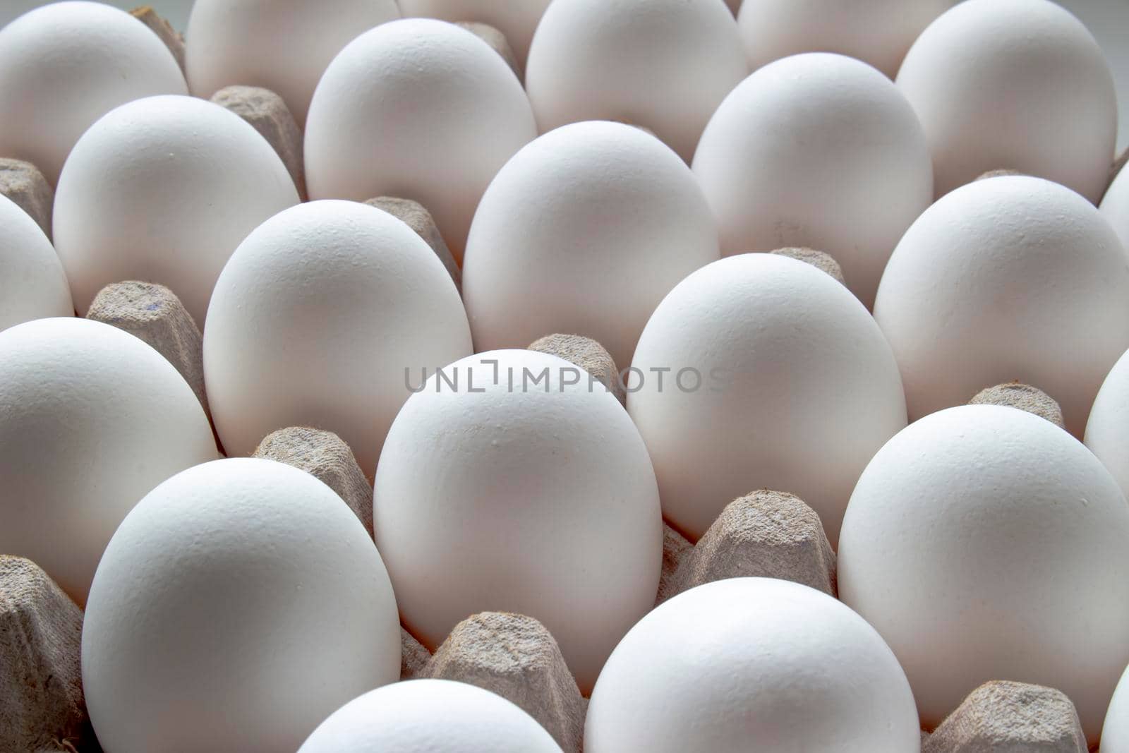 Close up of a Package Cardboard Egg Holder Egg Tray with eggs by oasisamuel